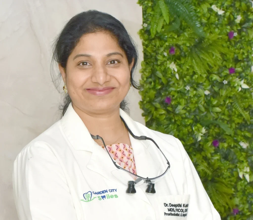 Dr Deepthi Kalahasti wearing her GardenCity Smiles white coat