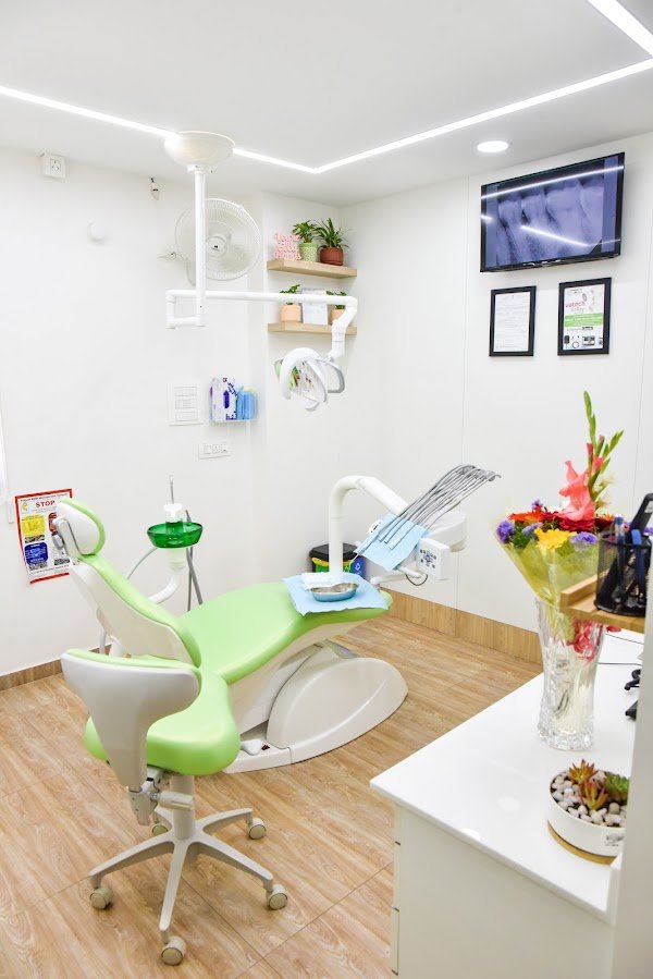 A dental chair, overhead light and treatment workspace at GardenCity Smiles™