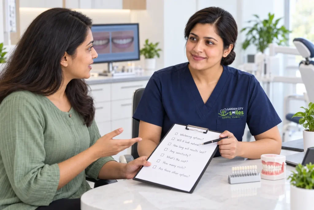 Indian patient discussing cosmetic dental questions with a GardenCity Smiles dentist
